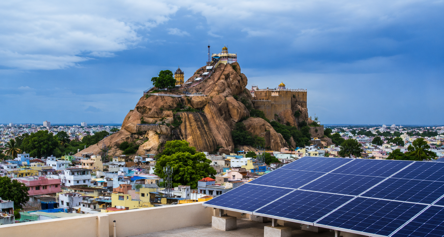 SVN Safetech solar panel installation in Trichy with Rock Fort landmark in the background